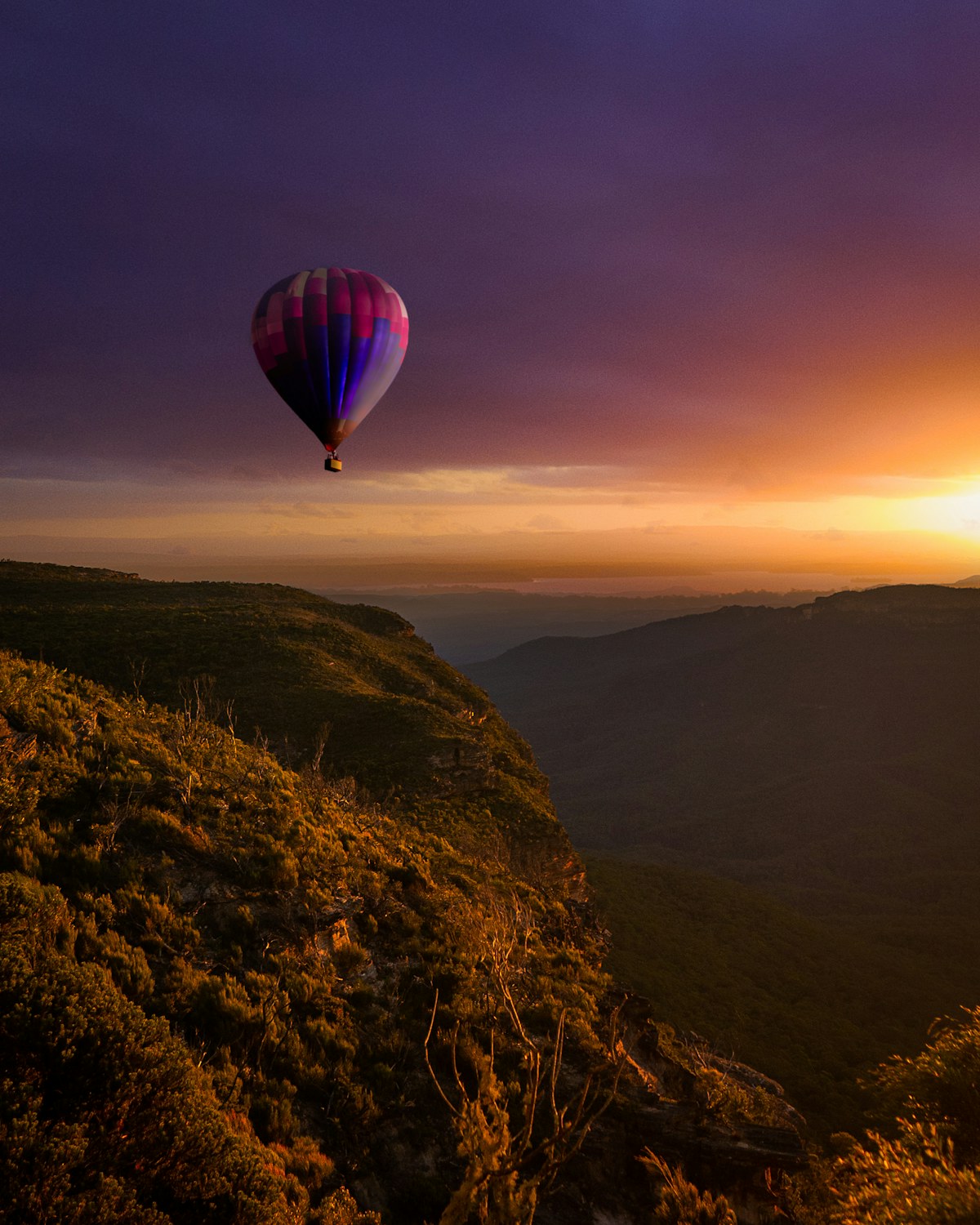 Hot air balloon at sunrise over the Atherton Tablelands