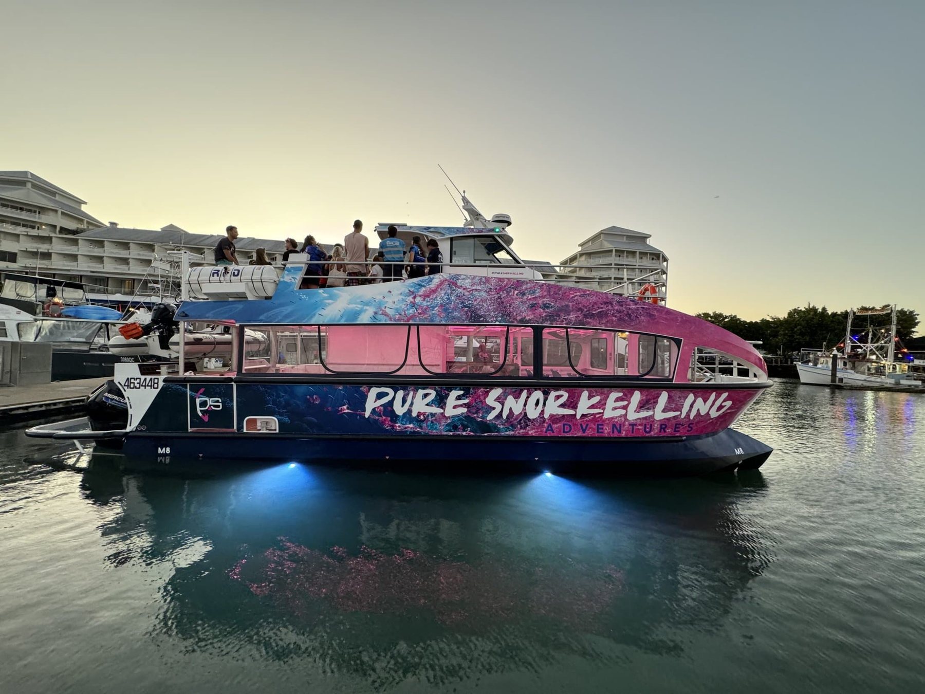 The Pure Snorkelling vessel berthed in Cairns at dusk