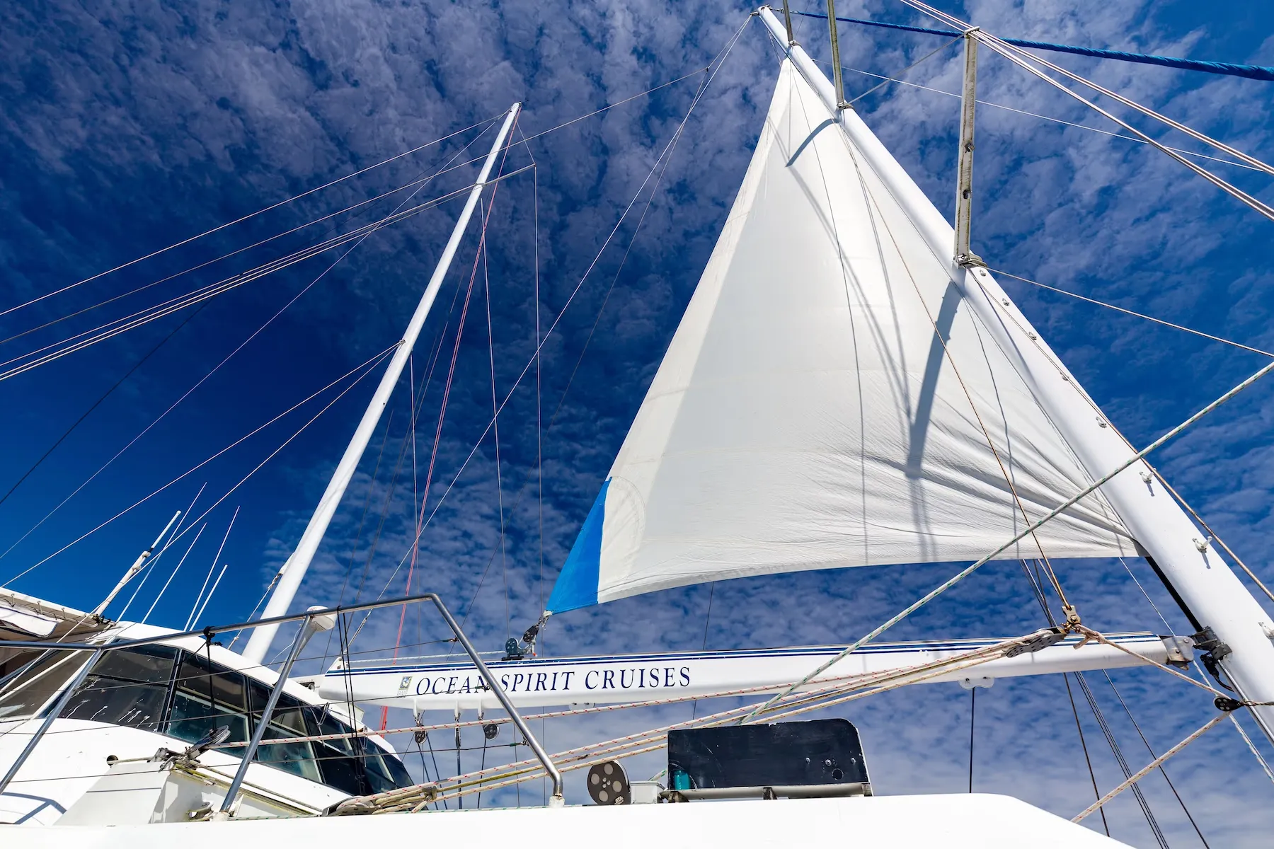 A sailing catamaran under sail on the Great Barrier Reef off Cairns