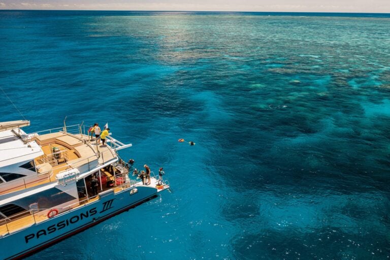 Boat at reef with snorkellers