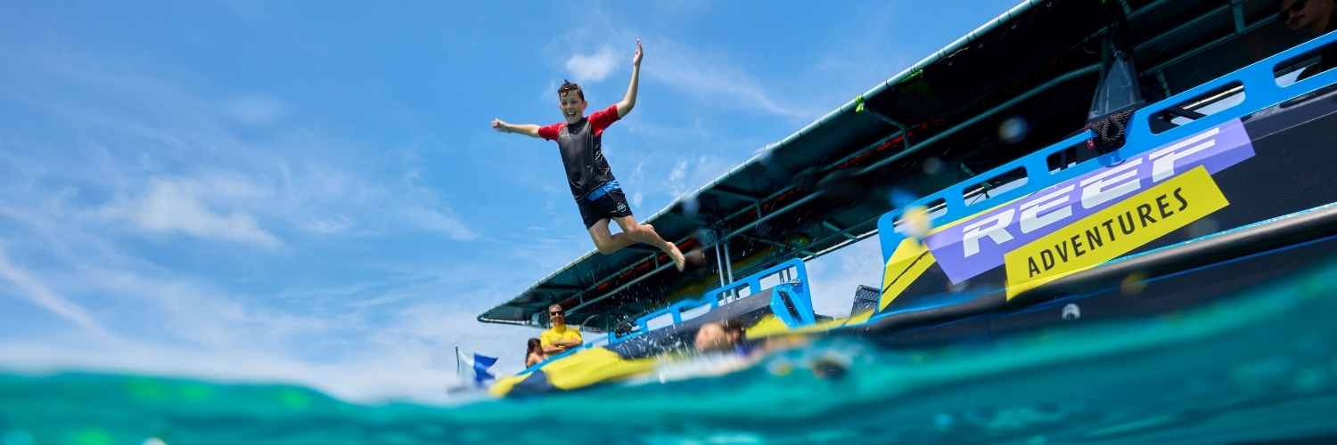 Guests jumping off the boat platform