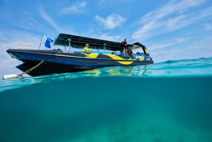 Reef Adventures boat departing Cairns
