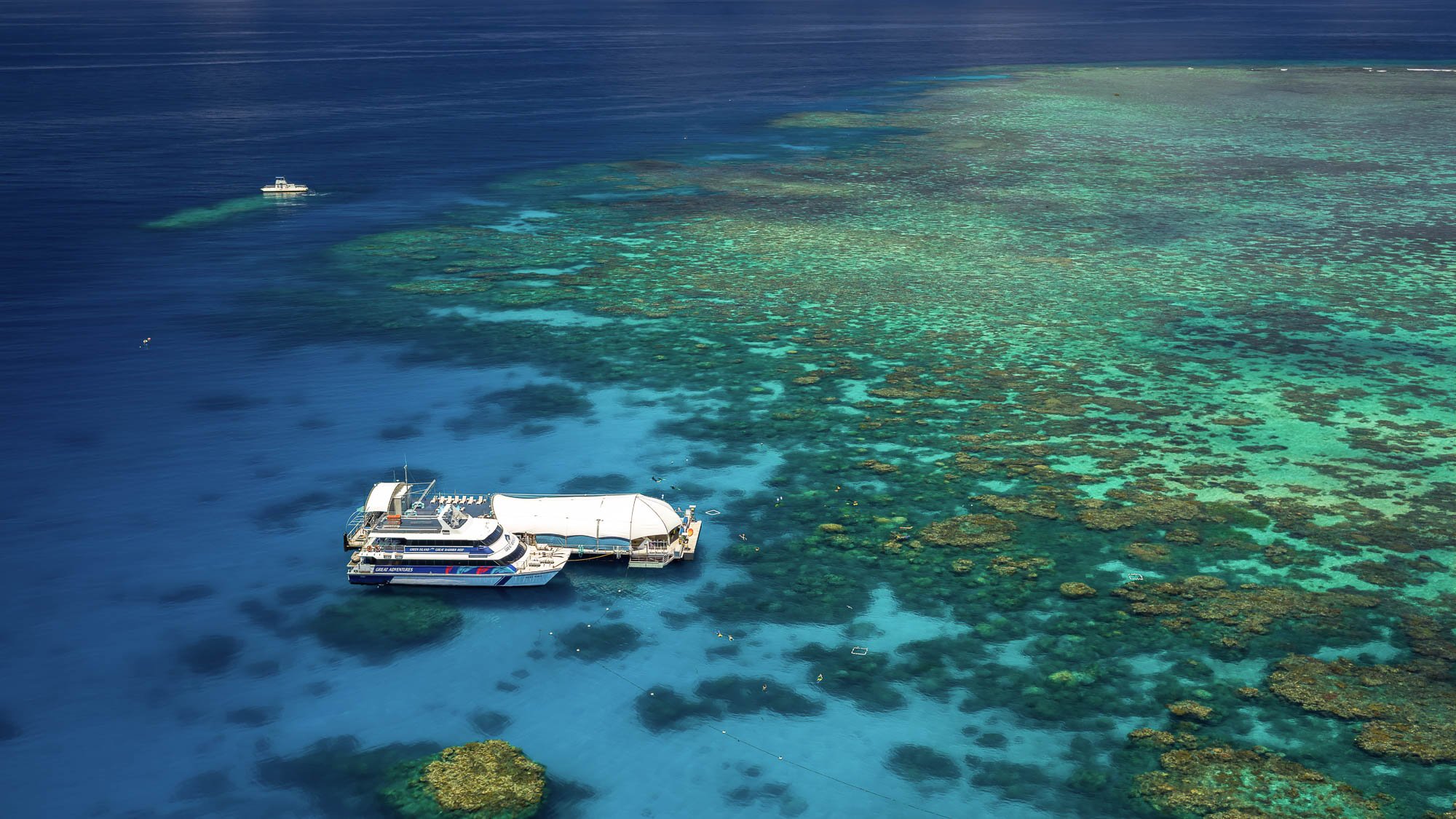 Aerial view of reef and boat