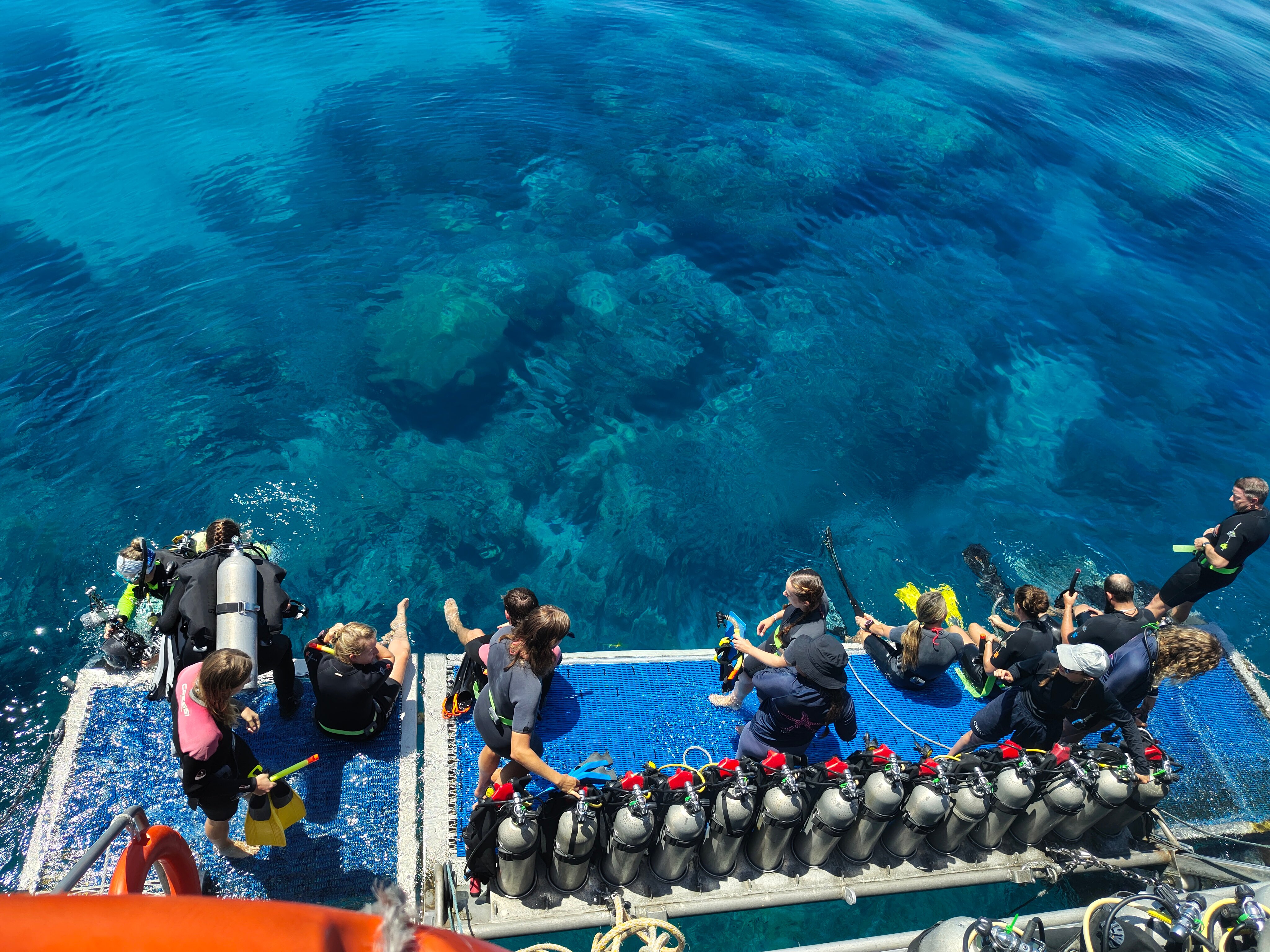 Divers gearing up on platform