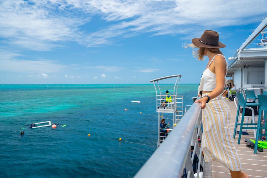 Guest overlooking reef from pontoon