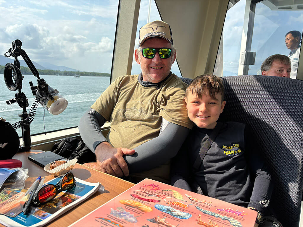 Family in cabin with reef maps