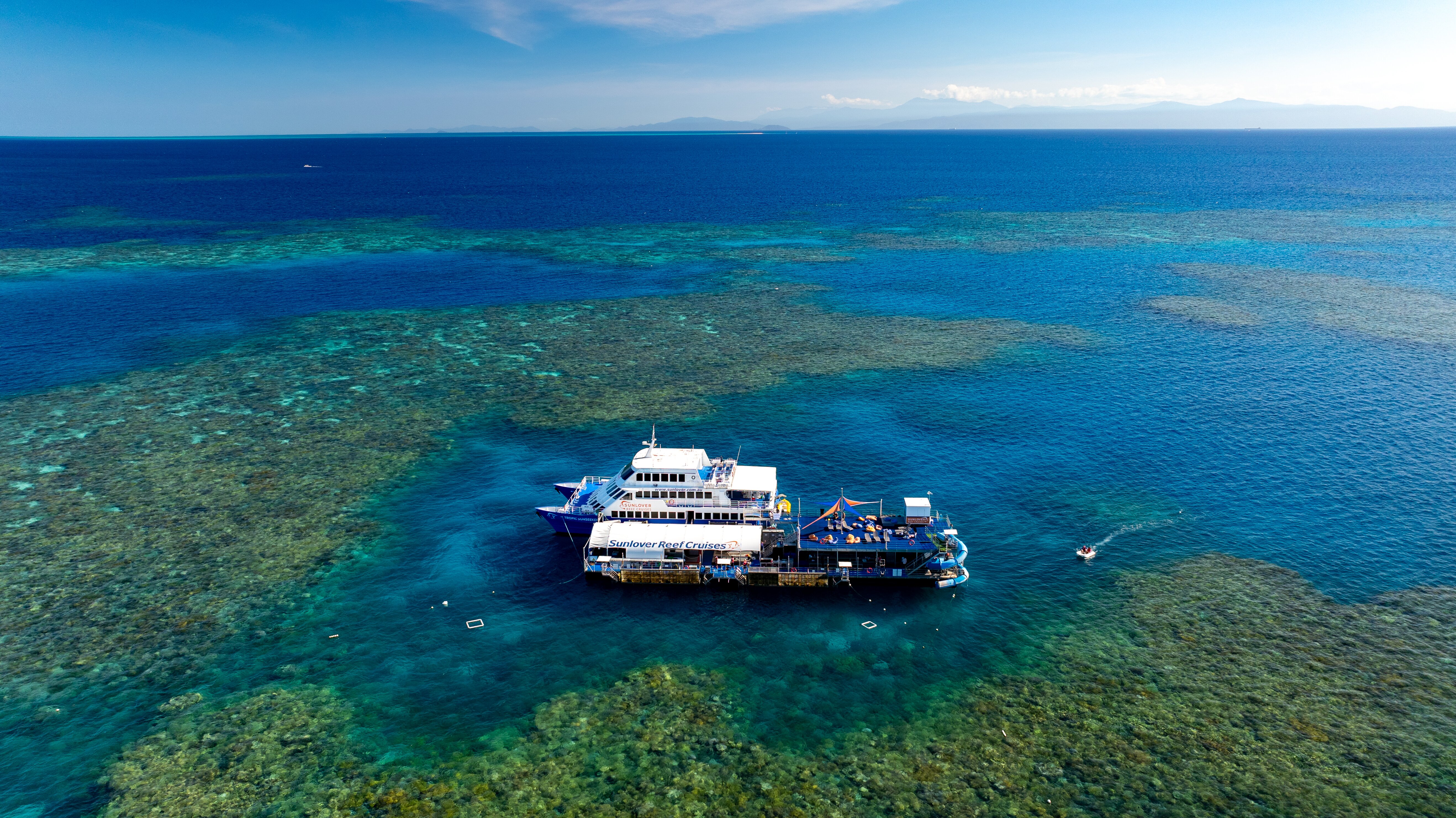 Aerial boat and pontoon at reef